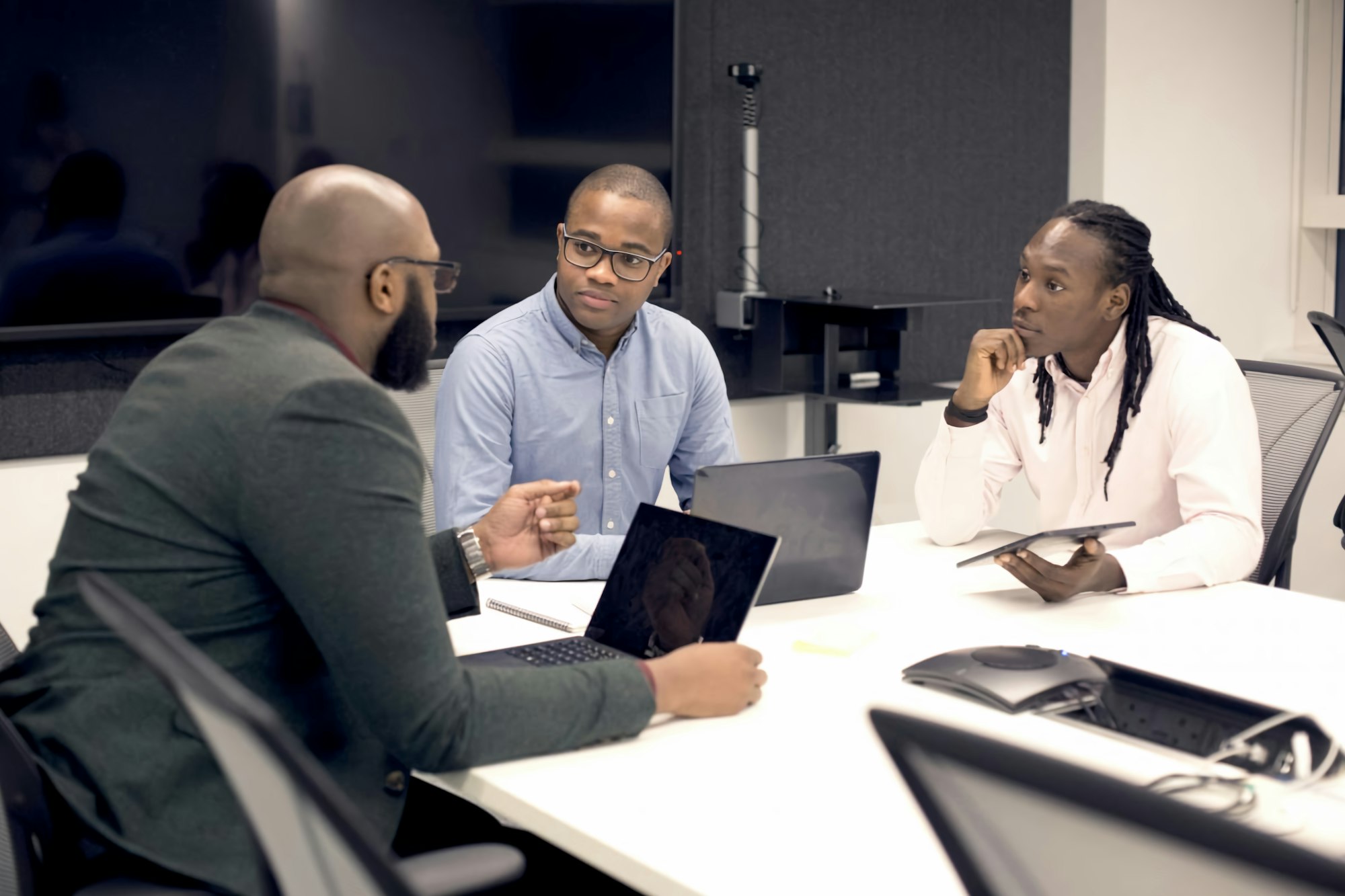 Healthcare executives in a facilitated strategy discussion around a conference table